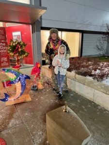 Scott Clausen ringing the bell for the red kettle campaign.