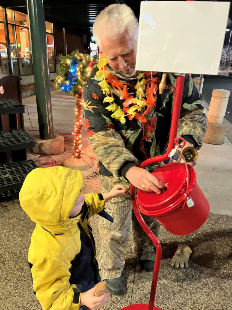 Christmas Bell Ringer Scott Clausen with Grandson