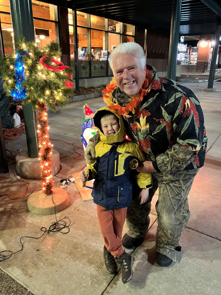 Christmas Bell Ringer Scott Clausen with Grandson